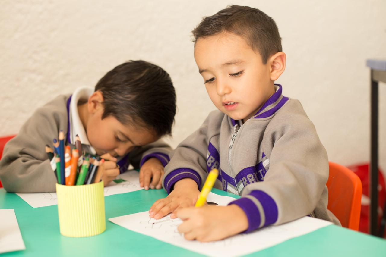 Student working on homework with support